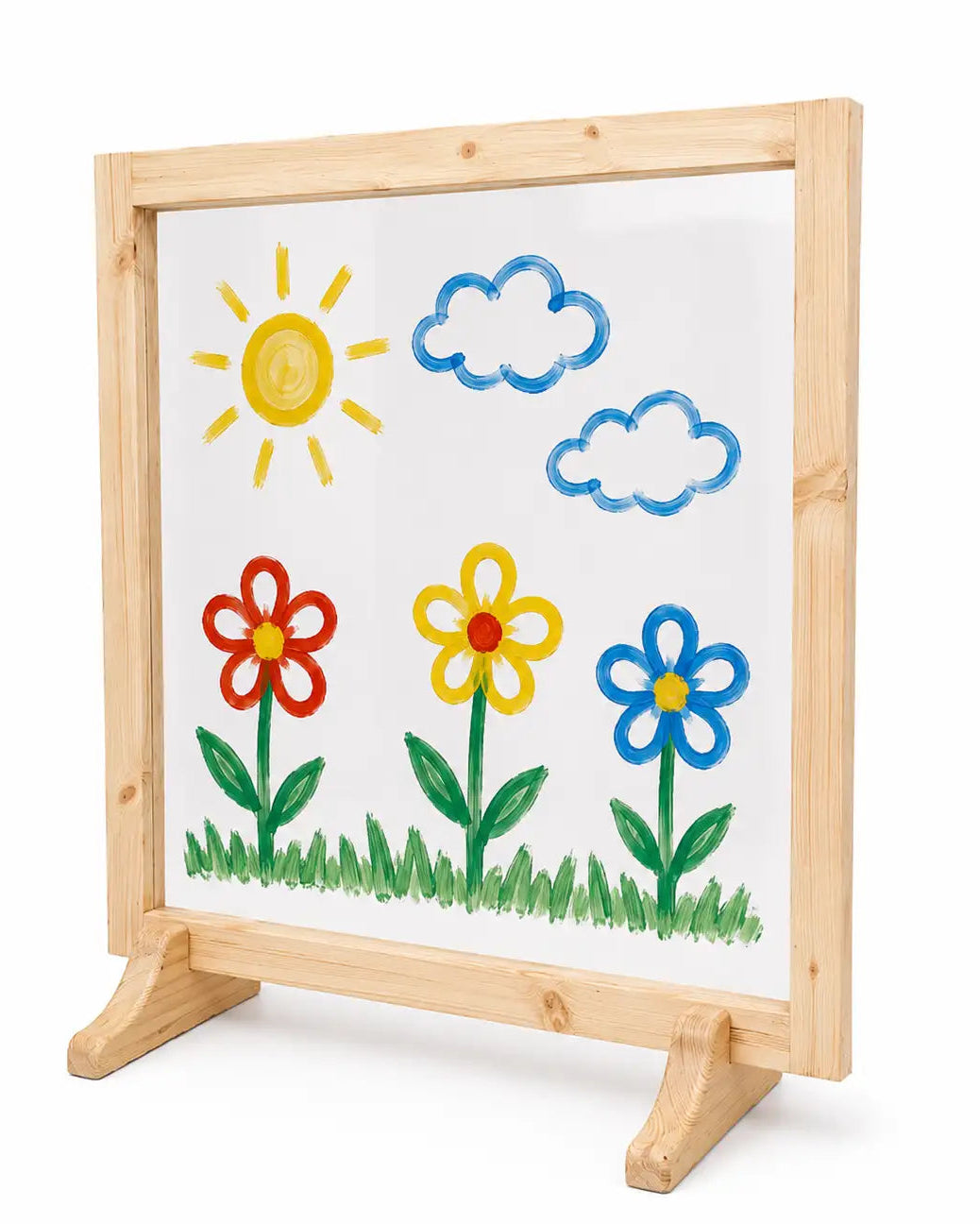 A wooden-framed acrylic painting board on a small easel stand, showing a childlike sun, clouds, flowers, and grass on a white panel. The product is photographed against a plain white background with a small text watermark at the bottom.
